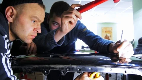 Two men repairing car Video stock 87846537