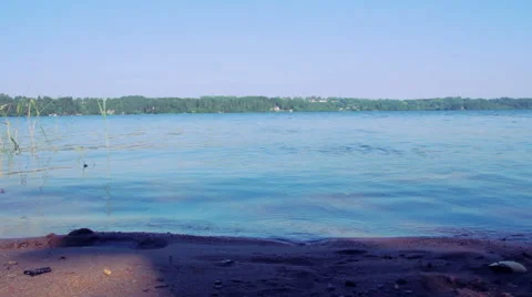 Two men run into the lake 스톡 동영상 40157083