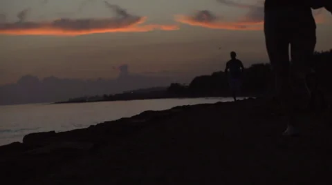 Two men running at night on the beach, slow motion shot at 240fps Stock-Footage 40314592