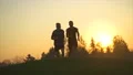 The two men running outdoor on the beautiful sunrise background. slow motion 4k or 4k+ Resolution