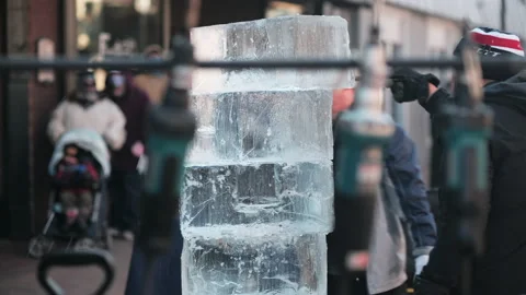 Two men sealing stack of ice blocks, preparing them for carving. Stock Footage 170002247
