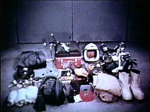 Two men securely strap Captain Joseph Kittinger, who is about to make anƒ Vidéo 75283321