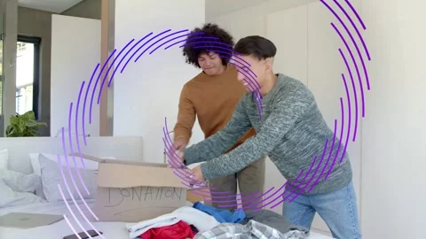 Two men seeing DONATION box, sorting, folding, passing clothes for charity, Stock Footage 333426114