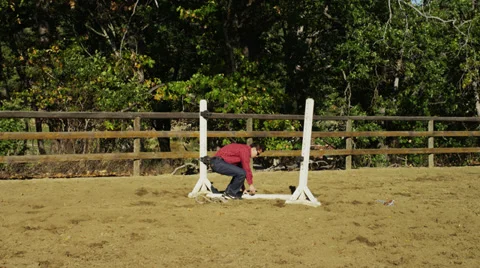 Two Men Set Up Hurdles Stock Footage 35310630