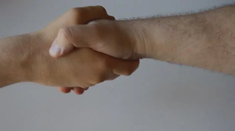 Two Men Shake Hands from Above Vídeo Stock 39970743