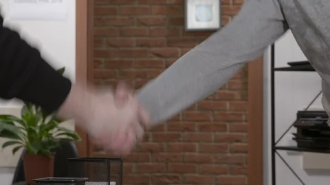 Two men shaking hands in the office. Close up footage of handshake Stock Footage 127121770