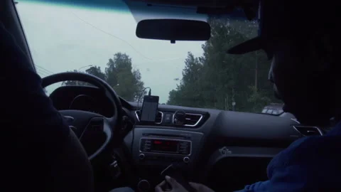 Two men sit in the car and wait Video stock 102362668
