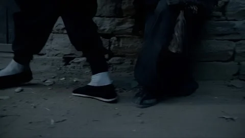 The two men skulk outside the house, behaving suspiciously Stock Footage 276517821