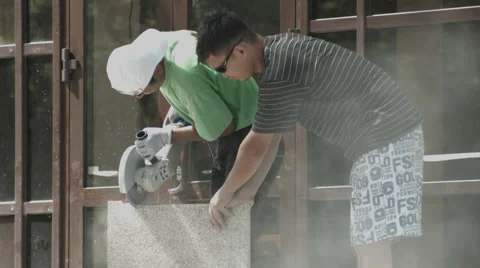 Two men slicing stone Stock Footage 59559069