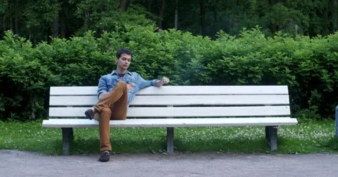 Two men smoke in the park. Stock Footage 52453289