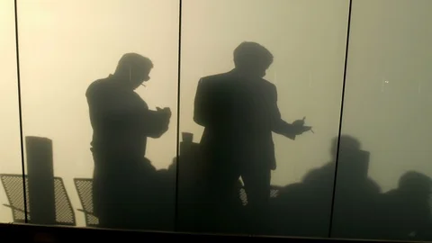 Two men smoking silhouette on screen Stock Footage 120087480