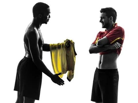 Two men soccer player  exchanging jersey standing silhouette Stock Photos