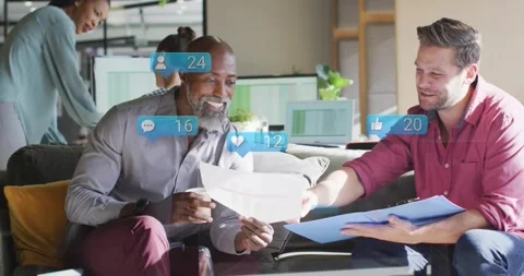 Two men on sofa reading docs for business, opening blue folder, pointing, icons Video stock 330444366