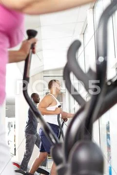 Two men spinning at the gym Stock Photos
