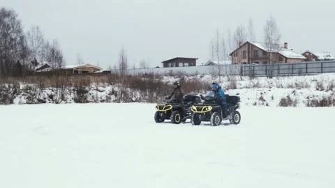 Two men staged an electric and petrol quadbikes competition Stock Footage 161178110