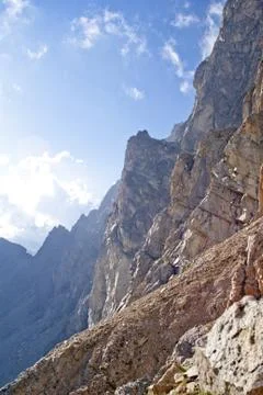 Two men stand on the top of large rock Stock Photos