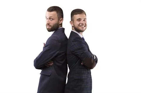 Two men standing back to back Stock Photos