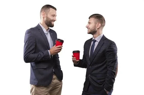 Two men standing with a cup of coffee Stock Photos