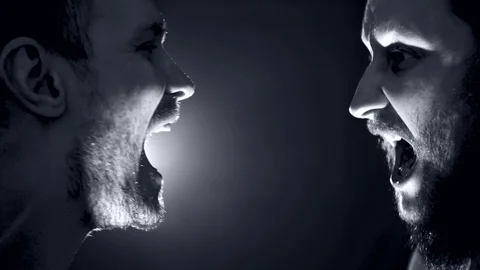 Two men standing face to face and yelling at each other. Negative emotion Stock Footage 124803543