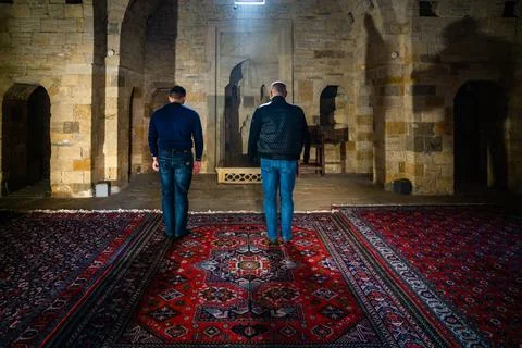 Two men standing to praryer Stock Photos