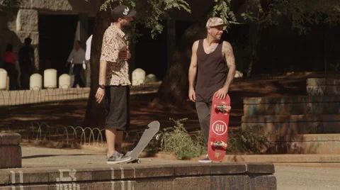 Two men standing with skateboard Stock Footage 61273758