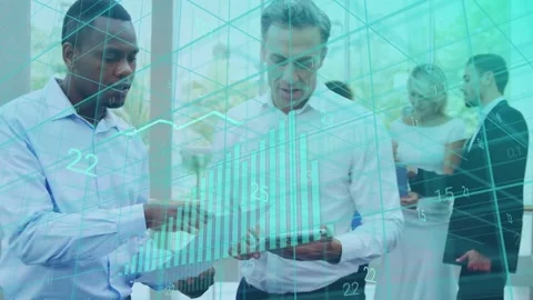 Two men stepping forward after overlay highlight, examining tablet and charts Stock Footage 335281932