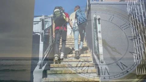 Two men stepping from lowest steps and traveling up toward upper walkway, clock Stock Footage 328365814