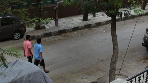 Two-men-in-the-street-walking-during-lockdown Stock Footage 128272309