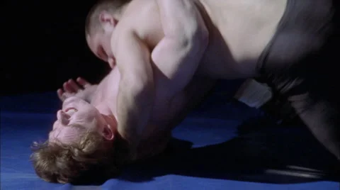 Two men struggle in a wrestling match. Stock Footage 5079853
