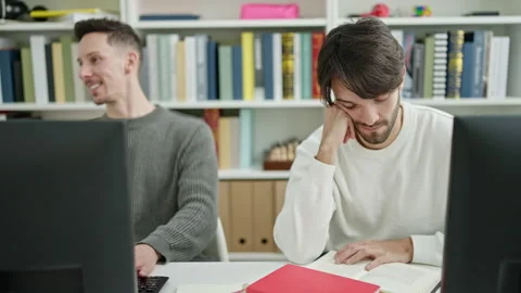 Two men students asking for silent studying at library university Video stock 236757678