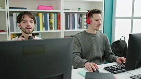 Two men students studying high five at library university Video stock 236757854