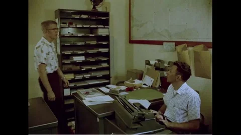 Two men submit their documents to manager - 1960 스톡 동영상 101163561