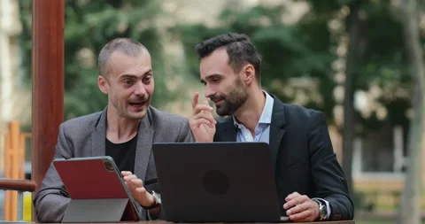 Two men in suits are discussing business Stockbeeldmateriaal 153706488
