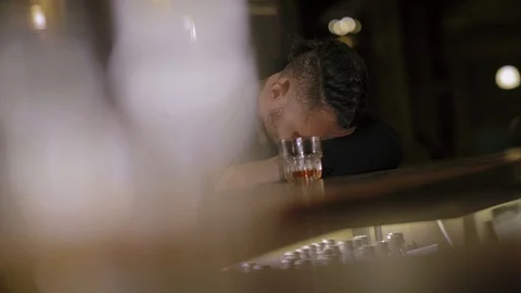 Two men in suits drink whiskey in a bar Stock Footage 105118640
