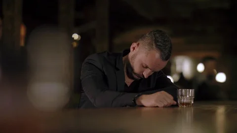 Two men in suits drink whiskey in a bar Stock Footage 105184525