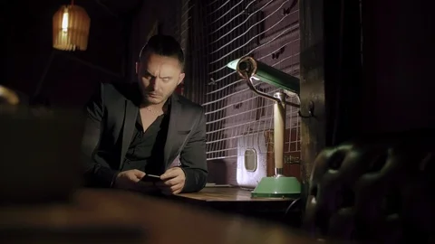 Two men in suits drink whiskey in a bar Video stock 105253043