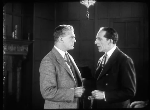Two men in suits in hotel office talking to each other, United Kingdom, 1923 Video stock 172219344