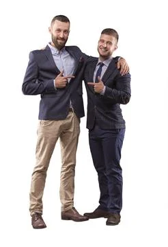 Two men in suits hugging Stock Photos