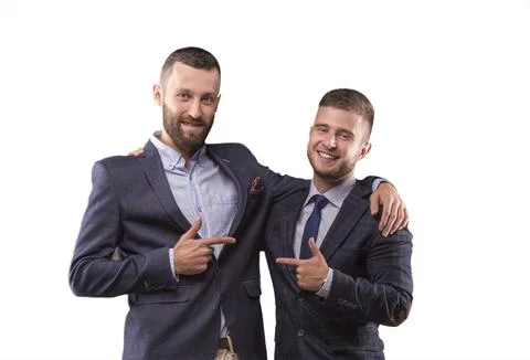 Two men in suits hugging Stock Photos