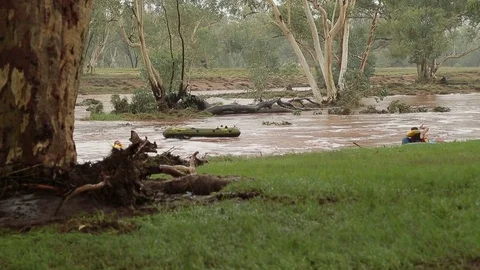 Two Men Swimming In The Dangerous Flooded Todd River In Alice Springs Stock Footage 70068043