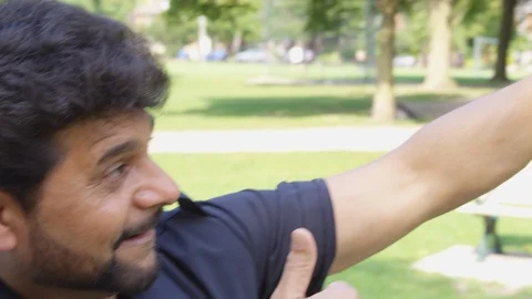 Two men take a selfie together outside - shot on RED Stock Footage 124717688
