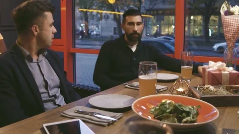 Two men talking about deals on party. Stock Footage 99565851