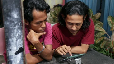 Two Men Talking And Looking At Smartphone, Close Up Stock Footage 168845976