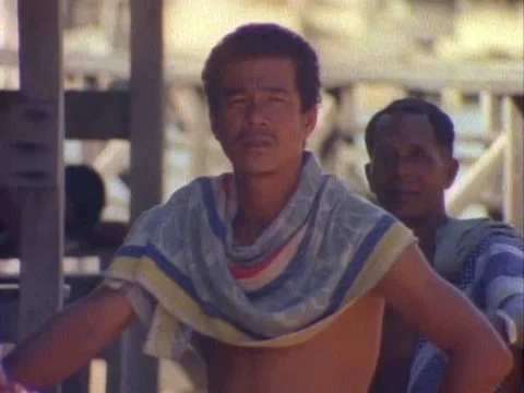 Two men talking to each other, while staring at the camera Stock Footage 79882605