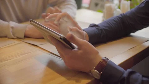 Two men talking over project using the tablet Stock Footage 72620235