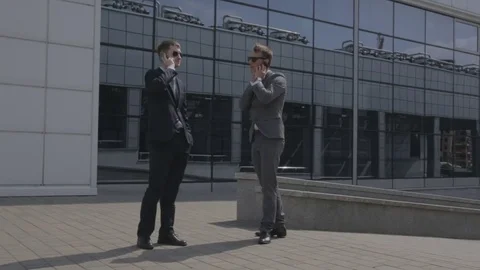 Two men talking on the phone Stock Footage 71749566