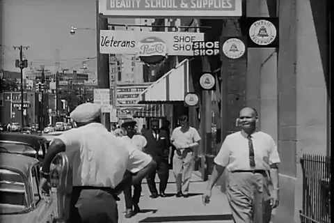 Two men talking on the streets of Atlanta, Georgia - 1950 Stock Footage 105683480