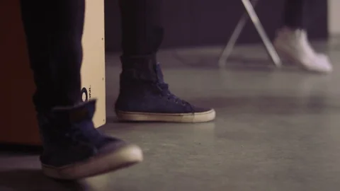 Two Men Thumping Their Feet to the Rhythm of Music Stock Footage 74845261