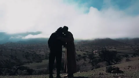 Two Men Traditional and Modern Overlooking Scenic Morocco Mountain Valley Stock-Footage 332772997