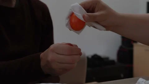 Two men traditionally beat eggs at Easter. Easter holiday and tradition Stock Footage 204131288